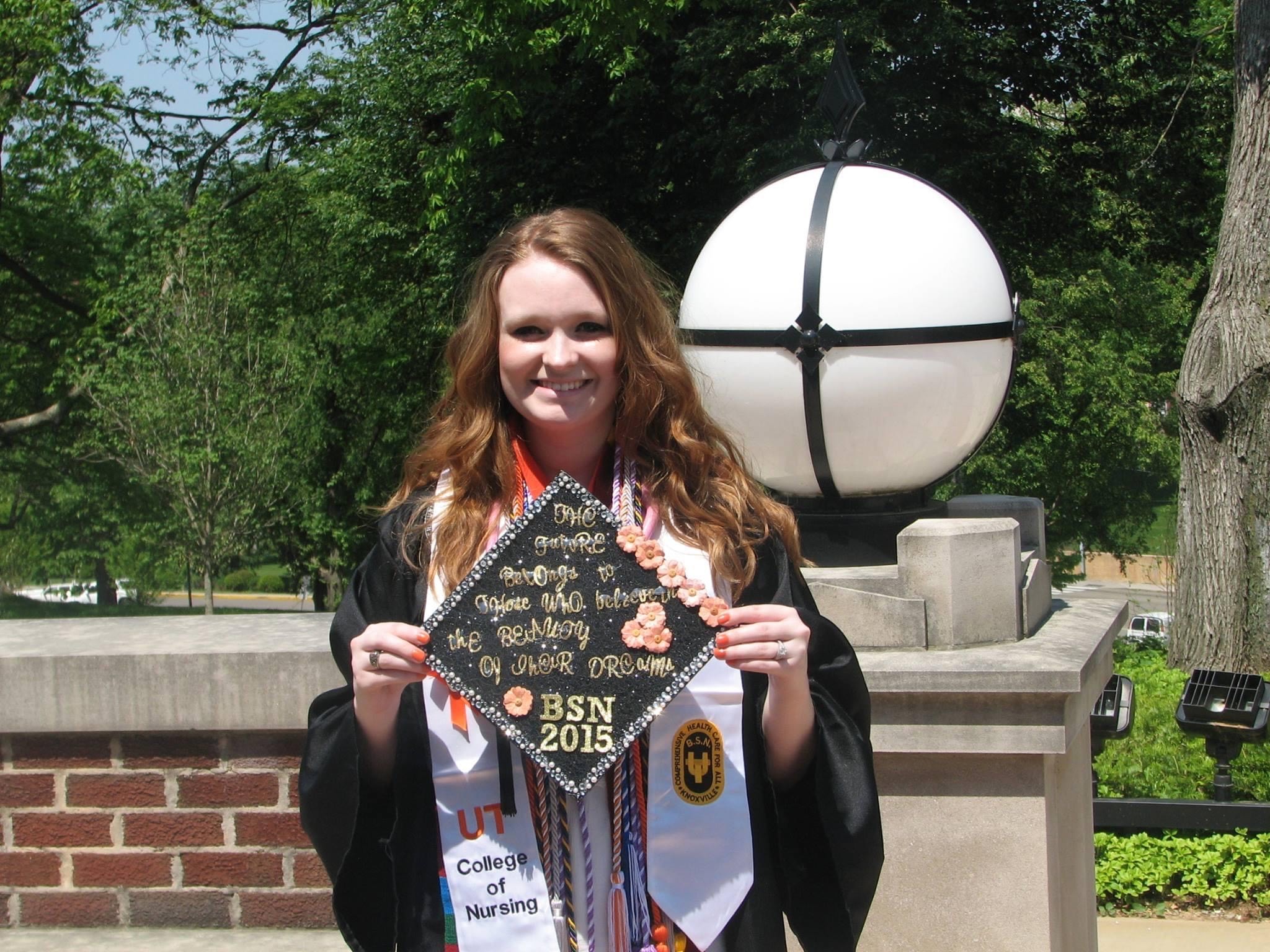 Nursing Alumna Autumn Fuselier stands for a photo following commencement