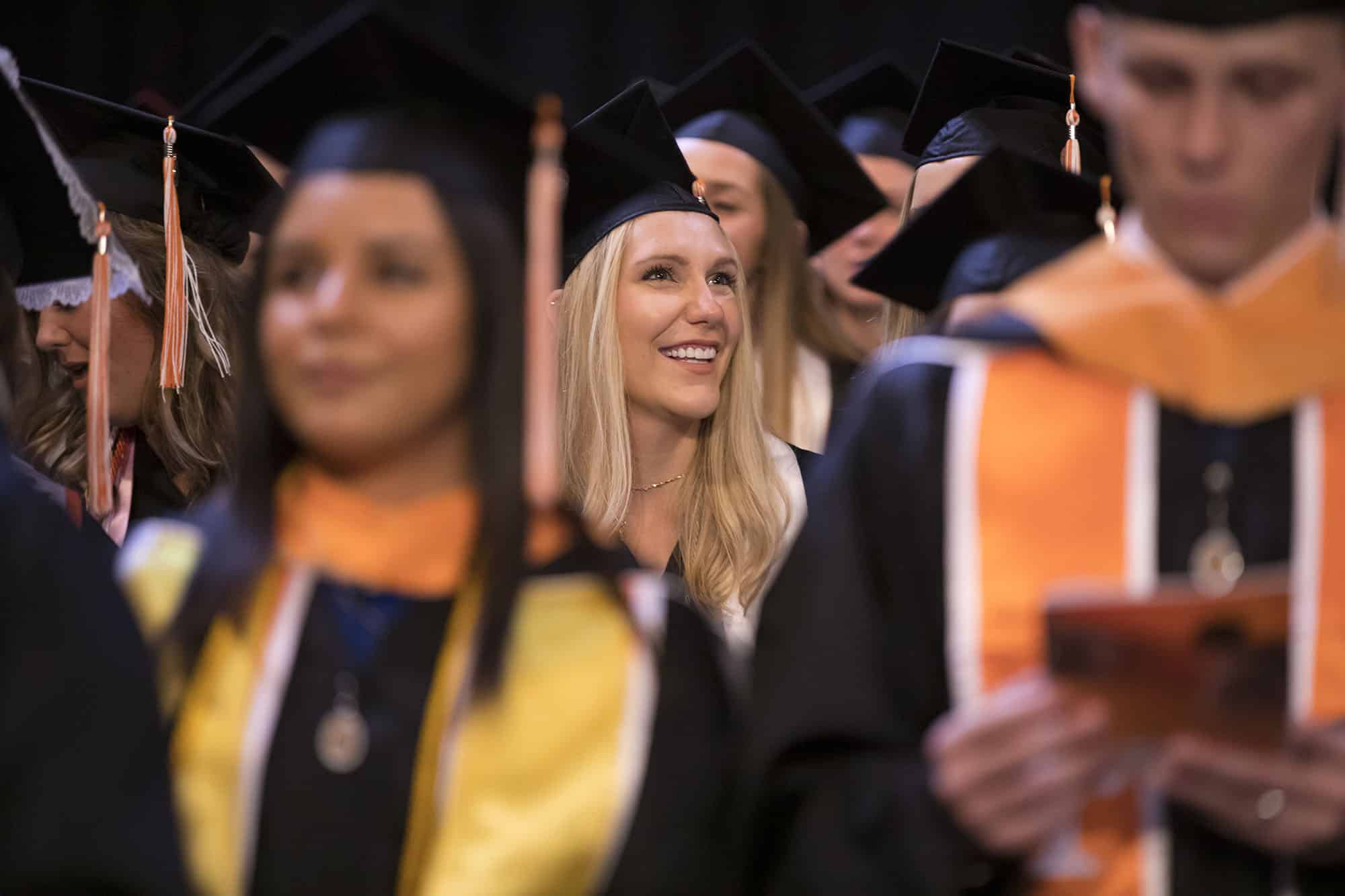 The singing of the alma mater during the College of Nursing Commencement inside Thompson-Boling Arena on May 10, 2019. Photo by Steven Bridges