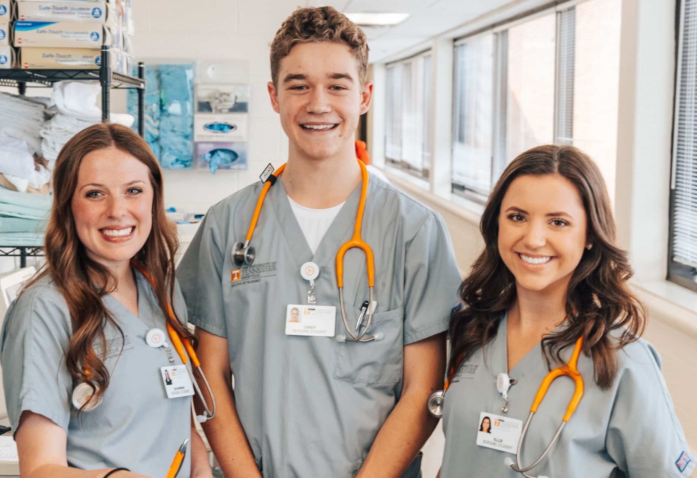 Nursing students pose for a photo in the lab.