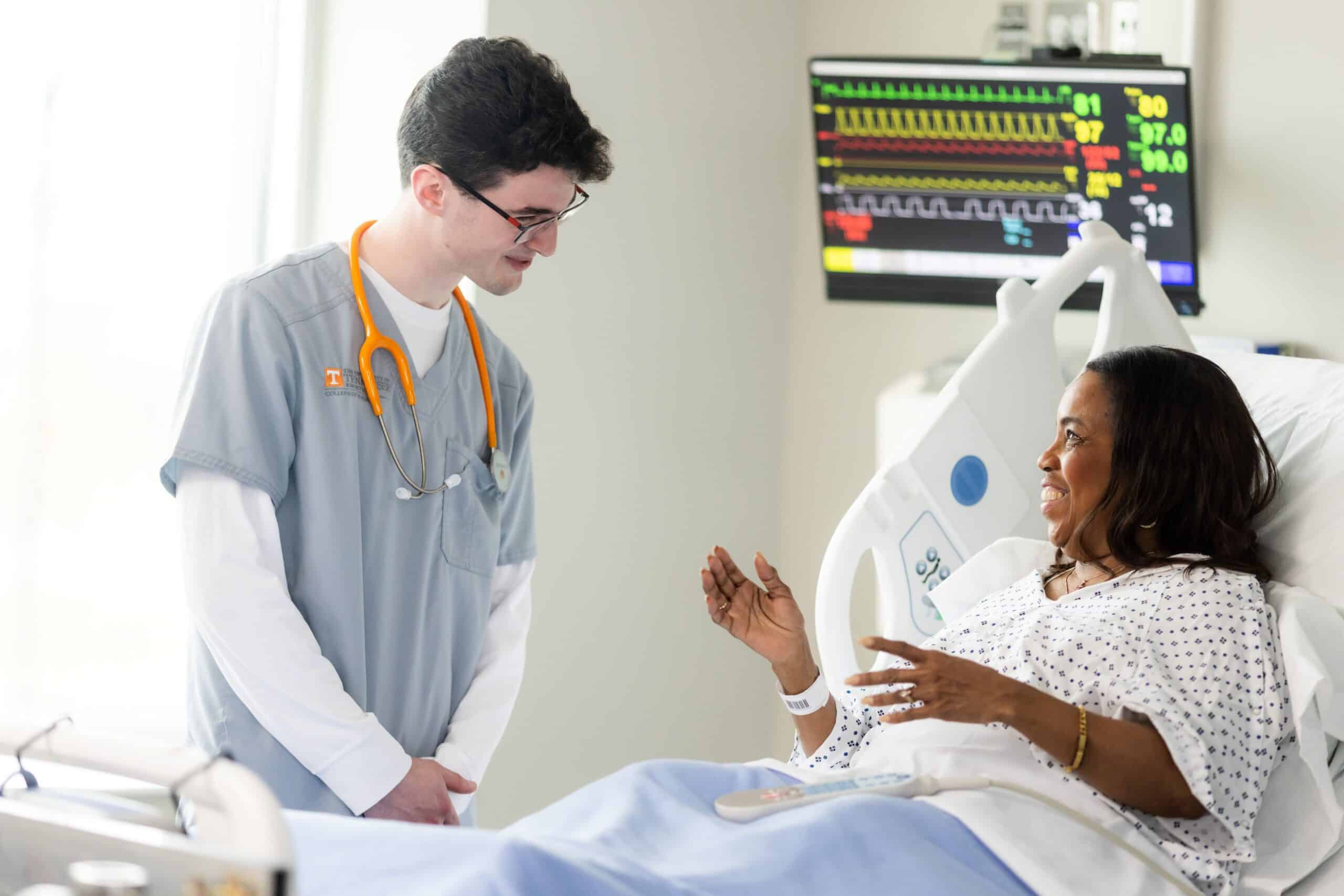 student talking to a simulated patient